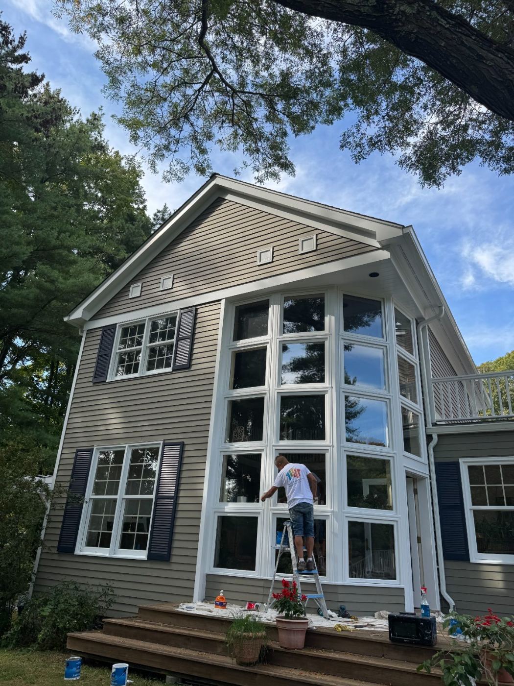 A Paint 4 Perfection painter finishing exterior window trim
